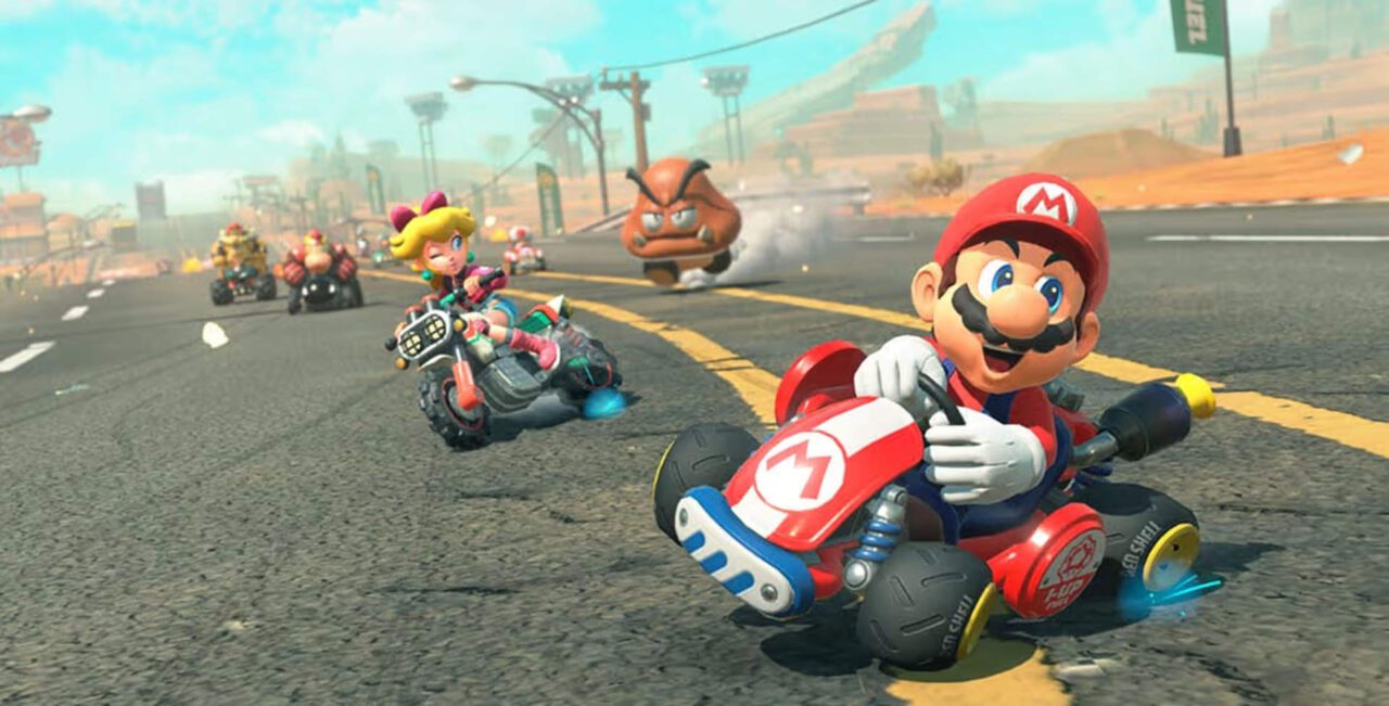 Mario Kart World - mario em primeiro lugar em uma corrida no deserto.